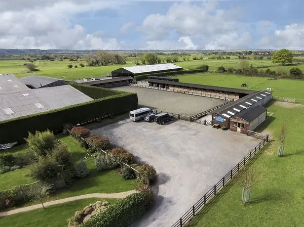 Aerial view of the car park, outdoor arena and stable blocks